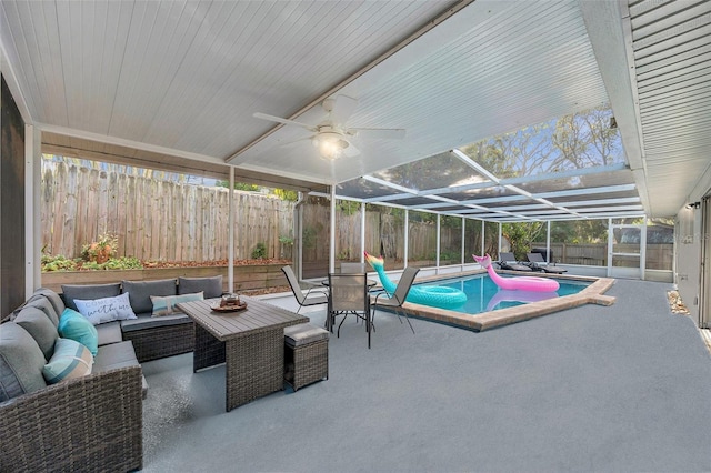 exterior space featuring a pool with hot tub, ceiling fan, and plenty of natural light