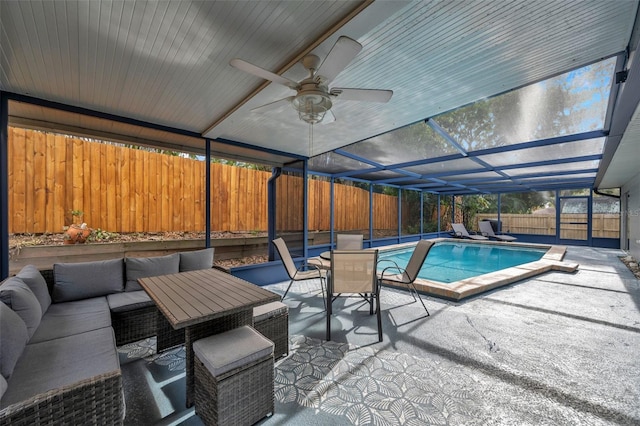 view of pool featuring an outdoor living space, a patio, ceiling fan, and a lanai