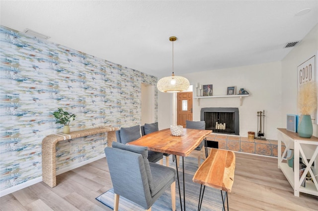 dining space with light hardwood / wood-style flooring