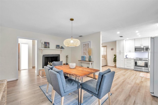 dining room featuring light wood-type flooring