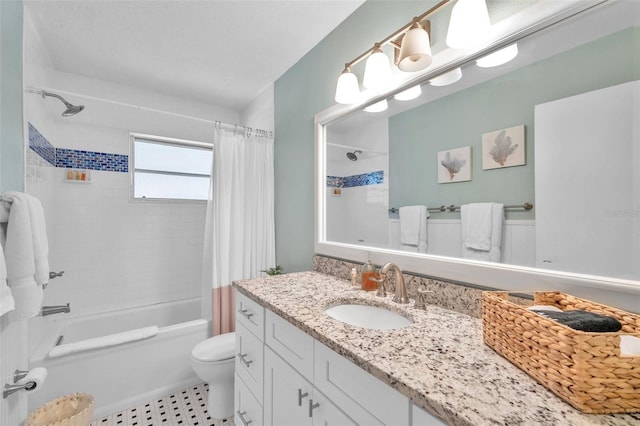 full bathroom featuring vanity, shower / bath combination with curtain, and toilet