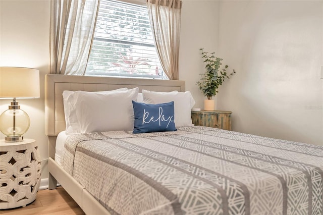 bedroom with light wood-type flooring