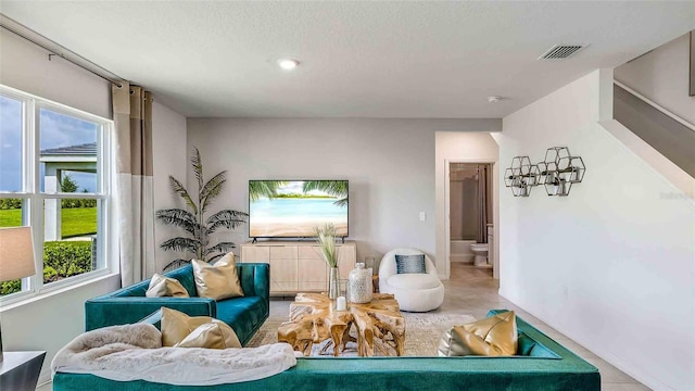 living room with a textured ceiling