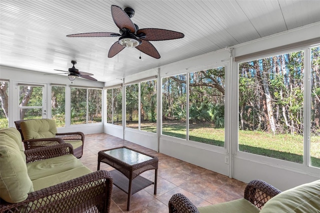 sunroom / solarium with ceiling fan