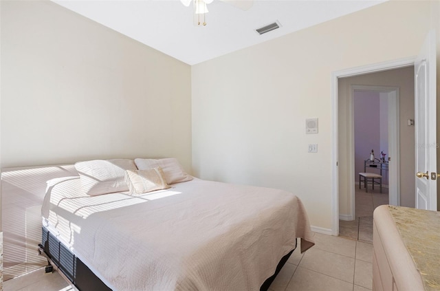 bedroom featuring light tile patterned floors and ceiling fan