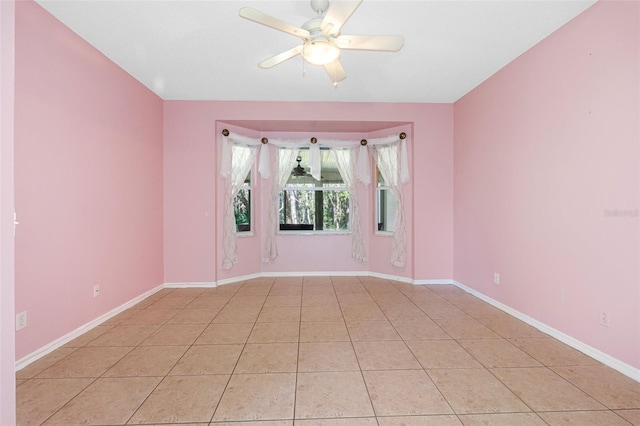 unfurnished room featuring ceiling fan and light tile patterned flooring