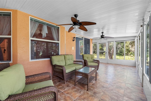 sunroom / solarium with wood ceiling and ceiling fan