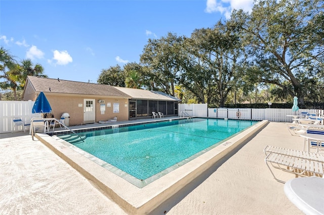 view of swimming pool with a patio area