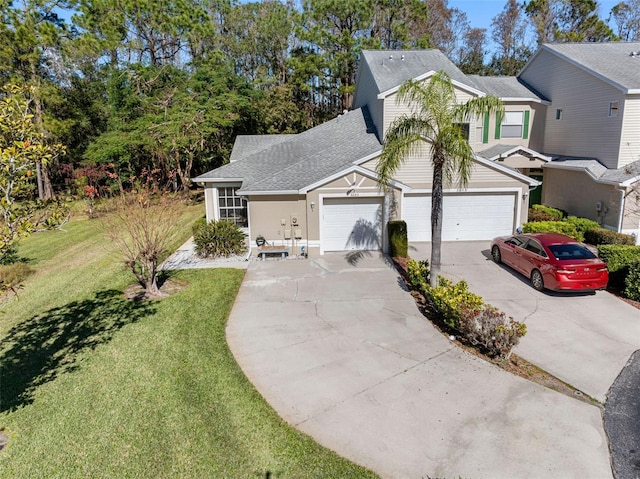 view of front facade featuring a garage and a front lawn