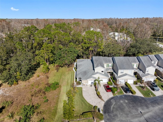 aerial view with a residential view and a view of trees