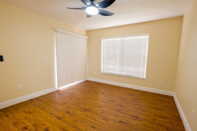 spare room with ceiling fan and hardwood / wood-style flooring