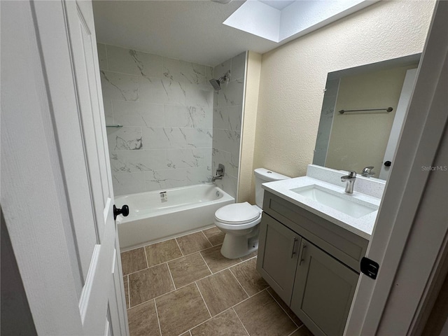 full bathroom featuring vanity, toilet, and tiled shower / bath combo