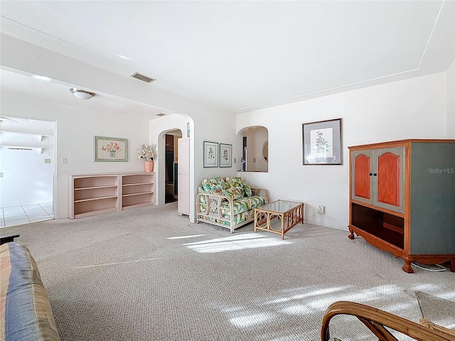 bedroom featuring light carpet