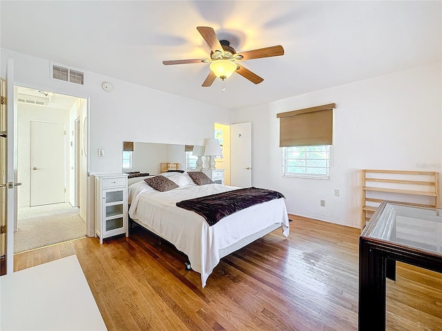 bedroom with hardwood / wood-style flooring and ceiling fan