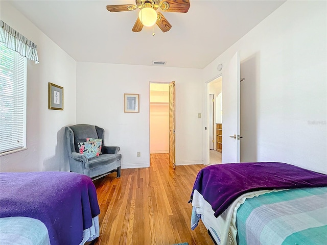 bedroom featuring light hardwood / wood-style floors and ceiling fan