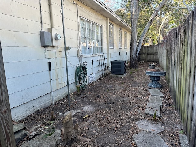 view of side of property featuring central AC unit