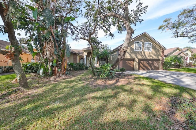 view of front facade with a front yard and a garage