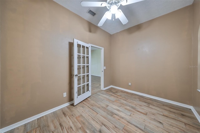 unfurnished room with french doors, light hardwood / wood-style floors, and ceiling fan