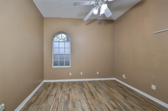 unfurnished room featuring light wood-type flooring and ceiling fan