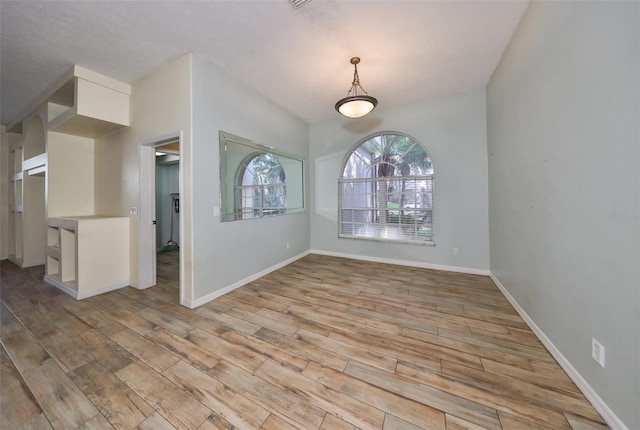 unfurnished room featuring light wood-type flooring