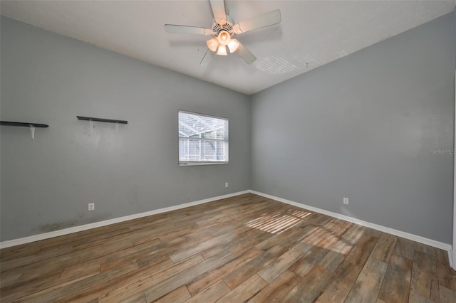 spare room with ceiling fan and hardwood / wood-style floors