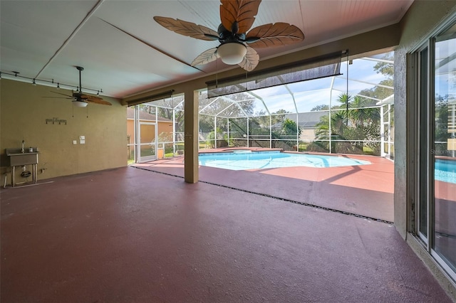 view of swimming pool featuring ceiling fan