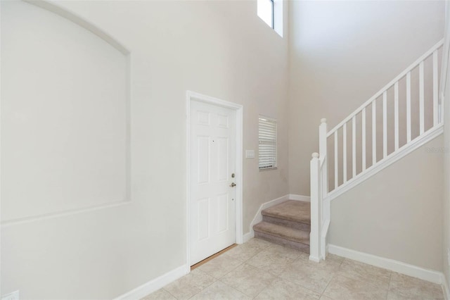 entryway featuring a high ceiling