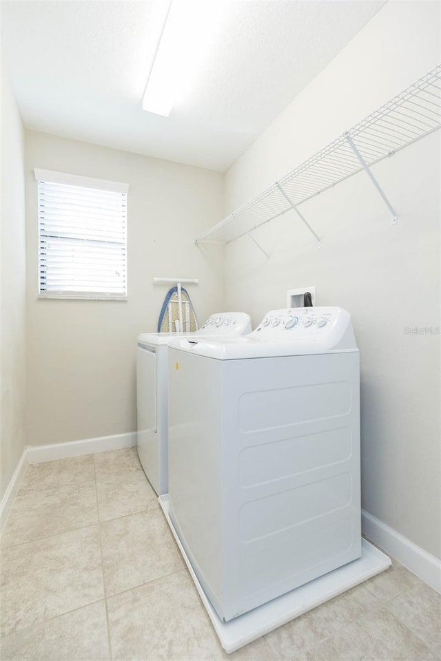 clothes washing area featuring washer and dryer