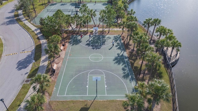 view of basketball court featuring a water view