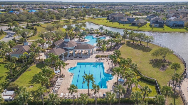 birds eye view of property with a water view