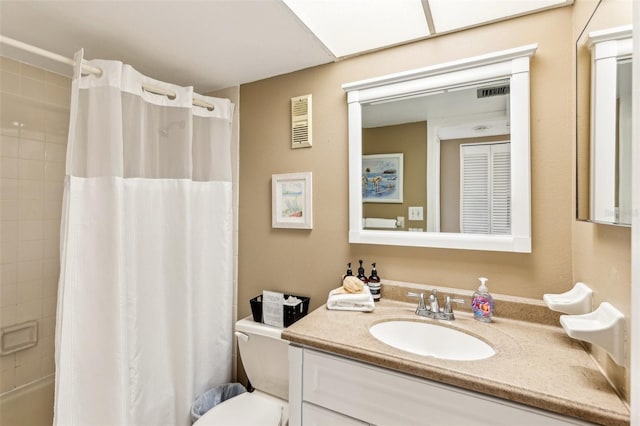 full bathroom with toilet, vanity, and shower / tub combo with curtain