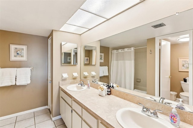 full bathroom with toilet, vanity, shower / tub combo with curtain, and tile patterned floors