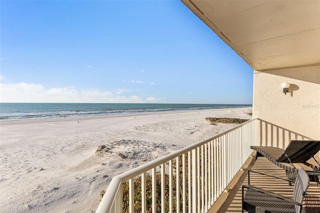 balcony with a view of the beach and a water view