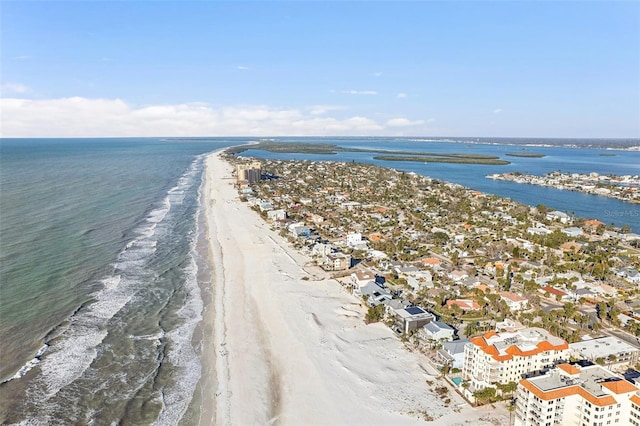 birds eye view of property featuring a view of the beach and a water view