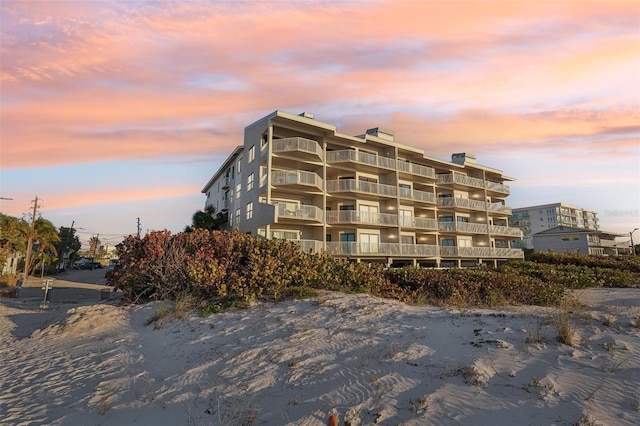 view of outdoor building at dusk