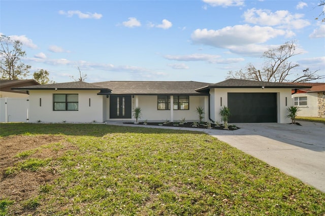 single story home with a front yard and a garage