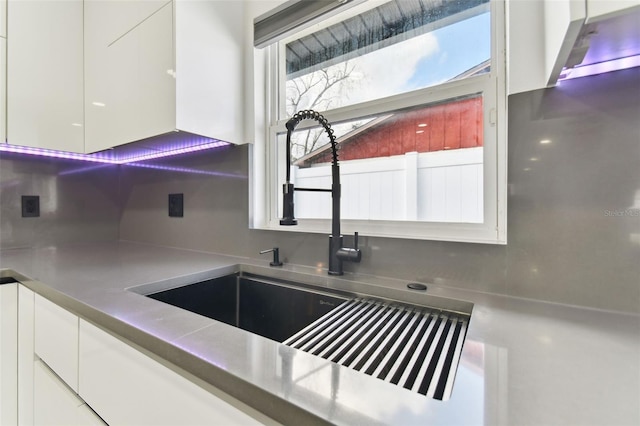 kitchen with white cabinets and sink