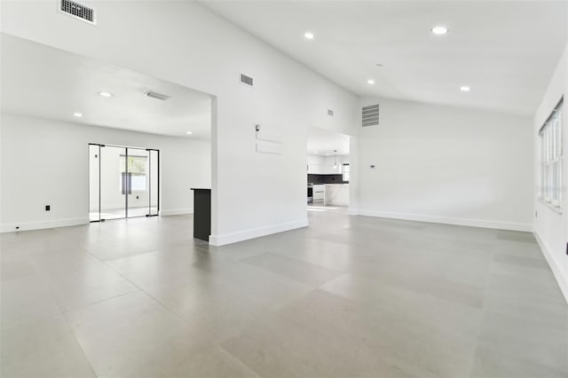 empty room featuring high vaulted ceiling