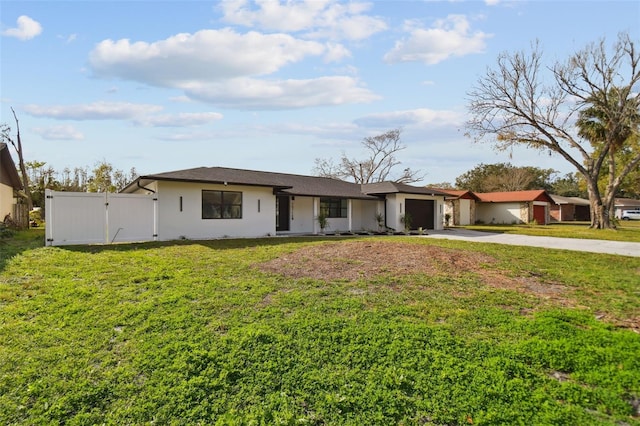 single story home with a front yard and a garage