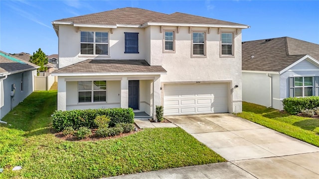 view of front of house featuring a garage and a front yard