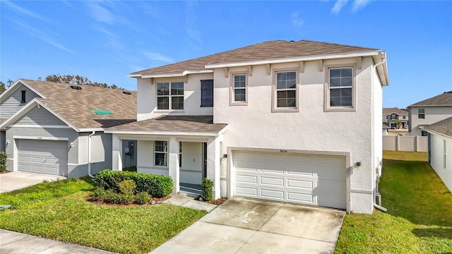 view of front of home featuring a garage and a front lawn