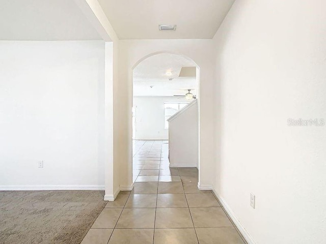 hallway with light tile patterned floors