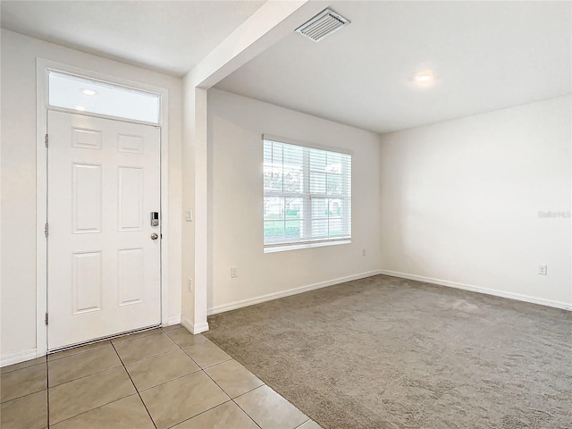 view of carpeted foyer