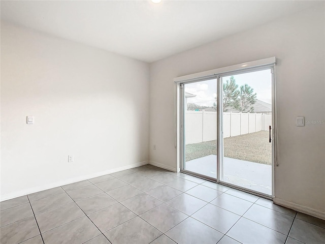 unfurnished room featuring light tile patterned floors