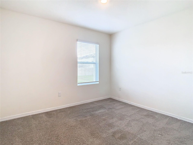 empty room featuring carpet flooring