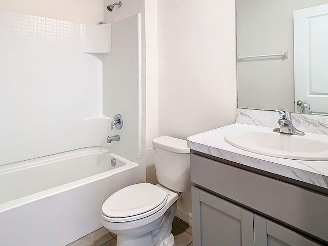 full bathroom featuring tile patterned flooring, vanity,  shower combination, and toilet