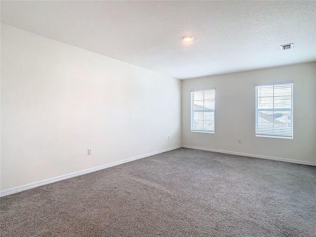 unfurnished room featuring carpet floors