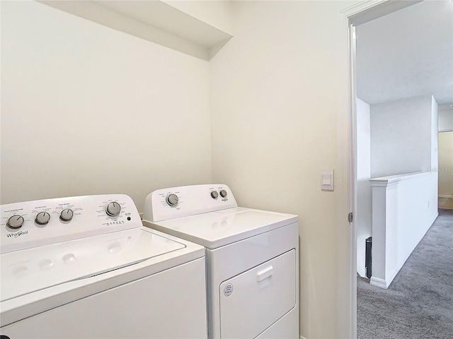 laundry room with carpet flooring and washing machine and clothes dryer