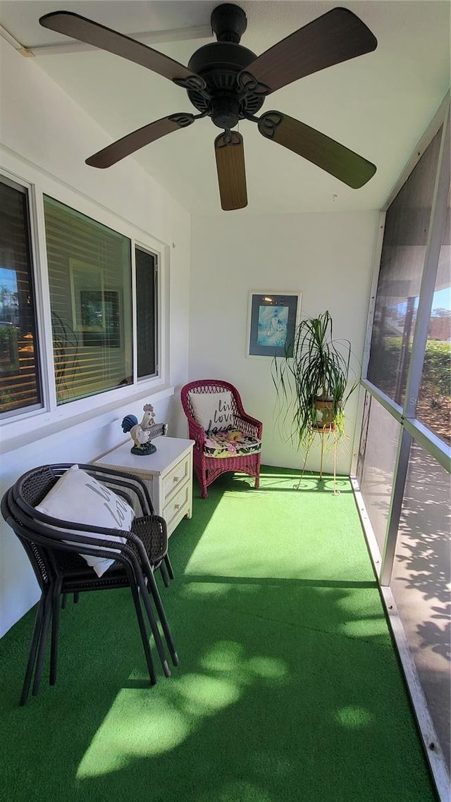 sunroom / solarium with ceiling fan