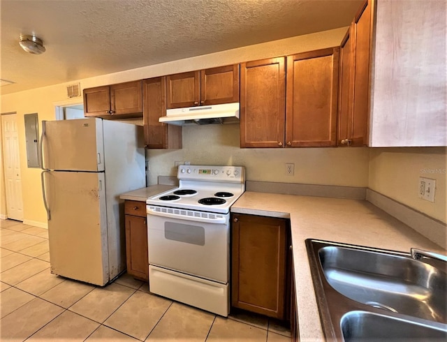 kitchen featuring sink, electric panel, a textured ceiling, white appliances, and light tile patterned floors